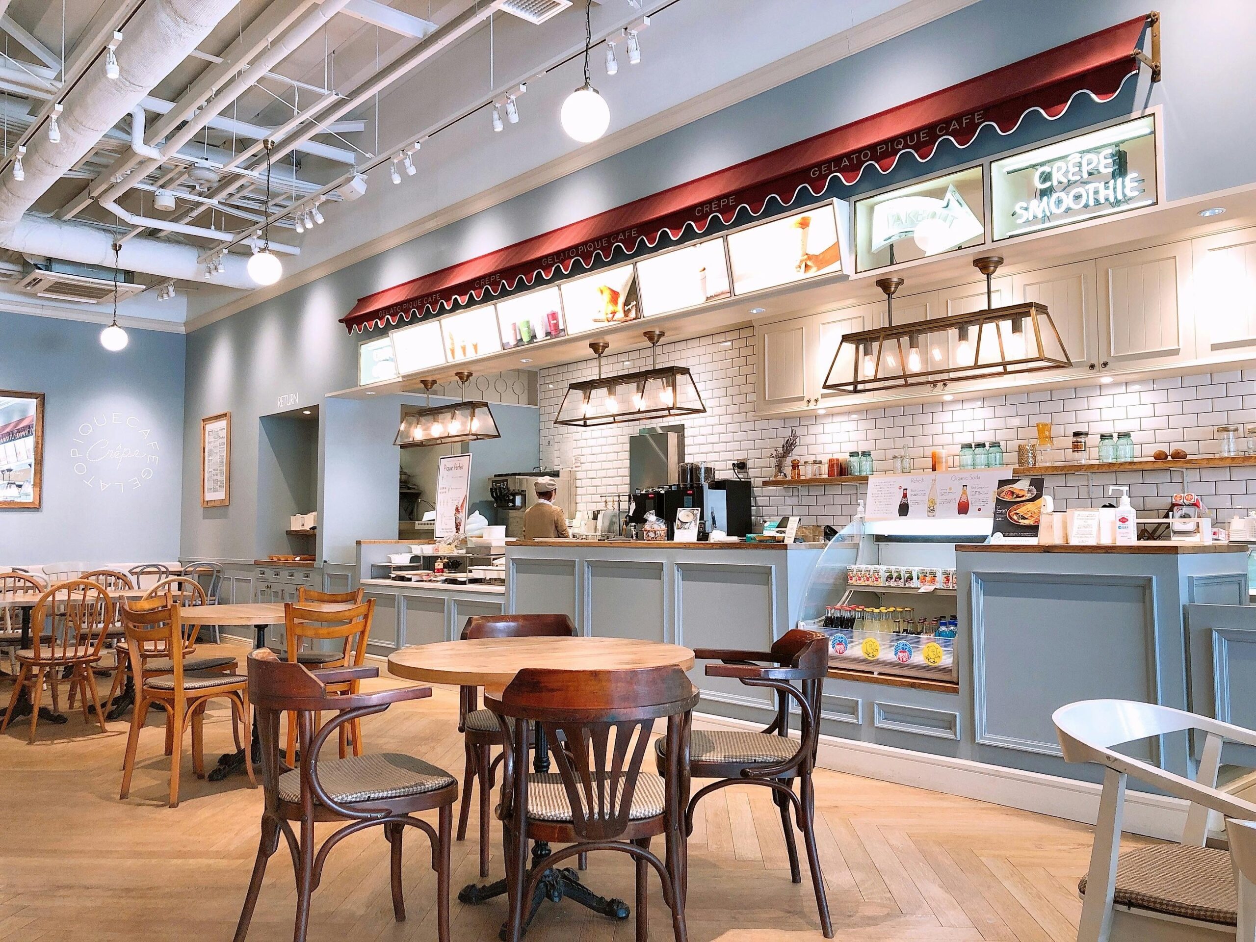 A welcoming café interior with wooden tables and modern design in Chiba, Japan.
